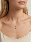 Moteriškas rausvo aukso apvalus pakabukas su cirkoniais
